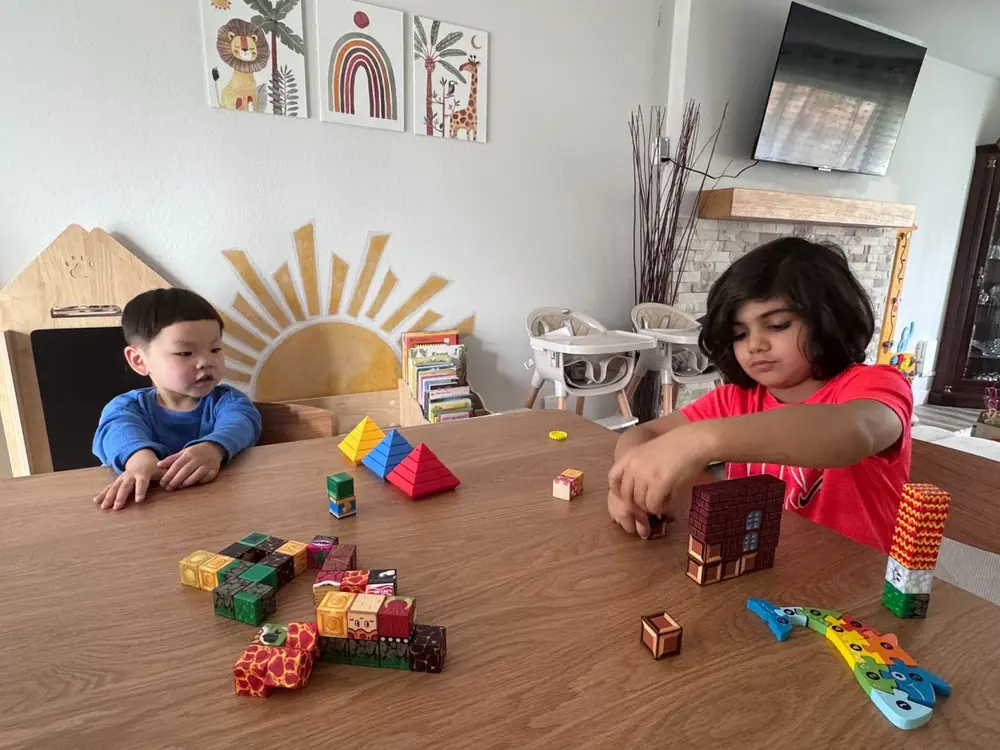 Child’s block creation of a zoo at Kido Heaven Child Care, fostering STEM skills in Bothell, WA
