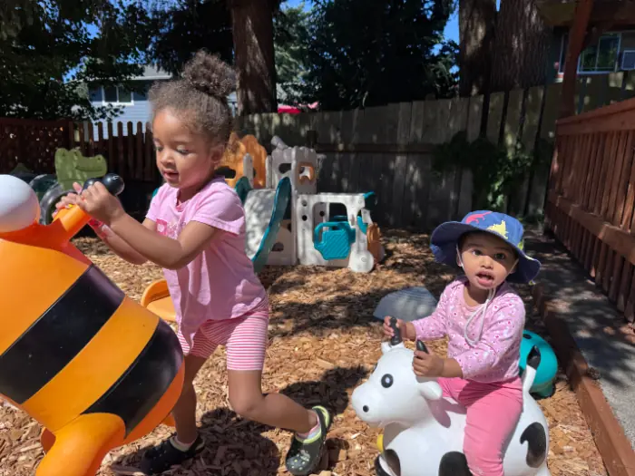 Children playing safely in a childcare environment prepared for emergencies.
