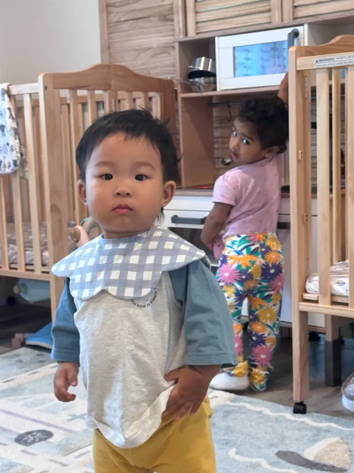 child playing comfortably in daycare classroom
