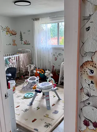 Baby chairs and a bright wall of decals